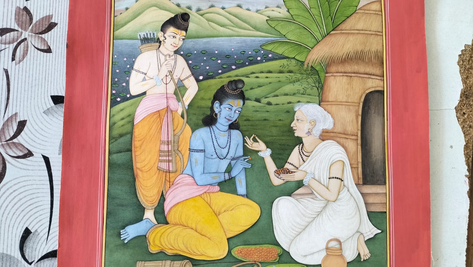 A hand-painted miniature scene with figures gathered in an ornate palace