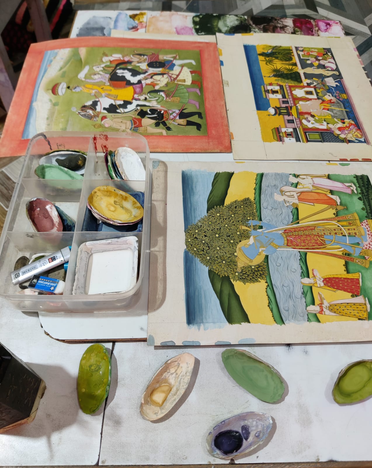 A hand-painted miniature artwork depicting a colourful Indian scene